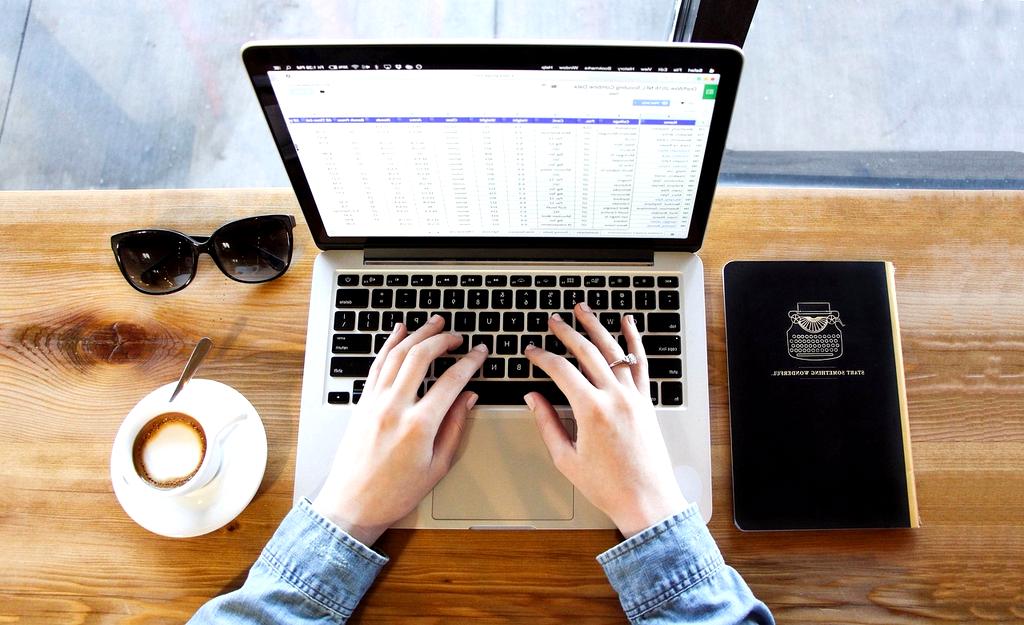 Person scheduling a live demo appointment on a laptop